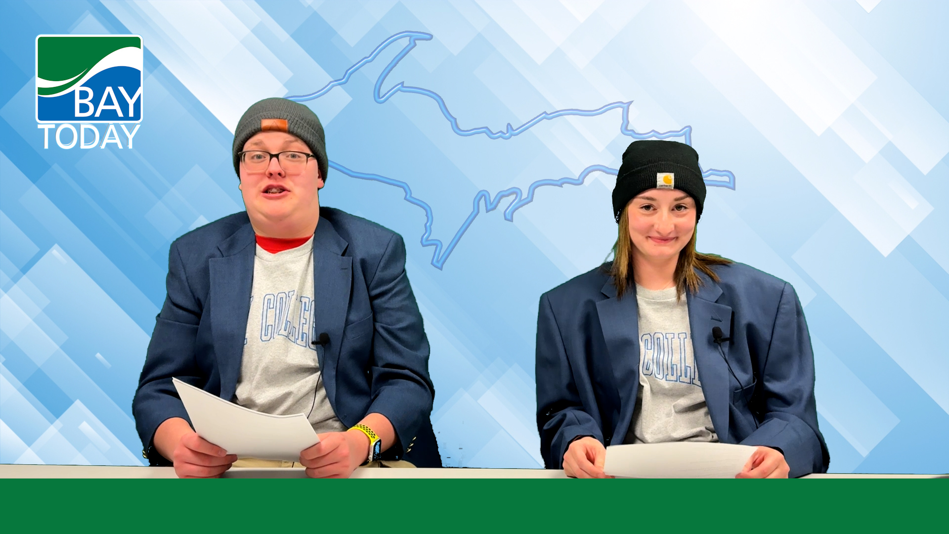 Bay Today Anchors Abe Wessel and Kelly Bergey deliver the news in winter hats and their blue Bay Today blazers.