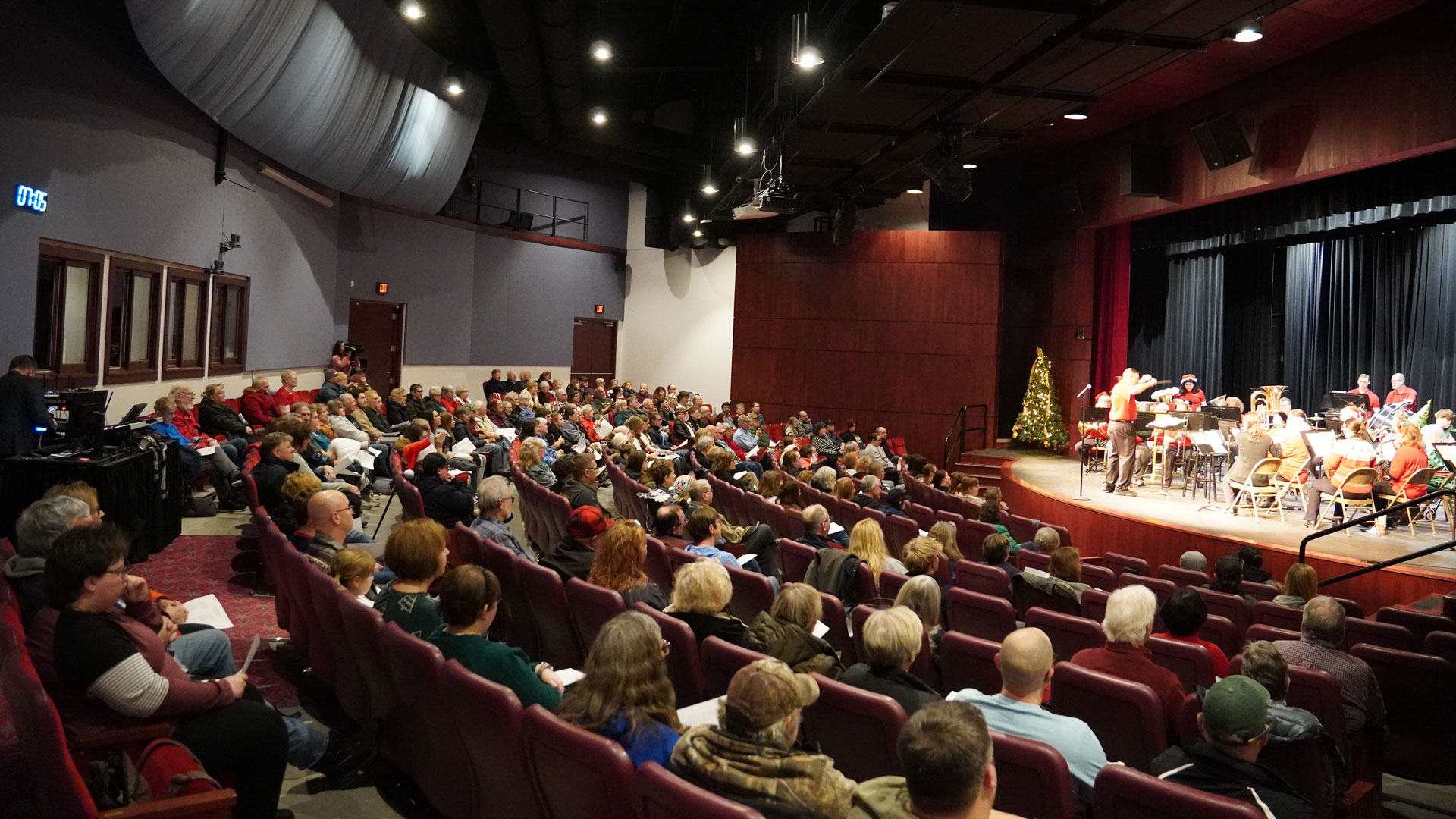 The view from the back of a full Besse Theater looking toward the stage during the performance by the Escanaba City Band on the 2025 Day of Giving.