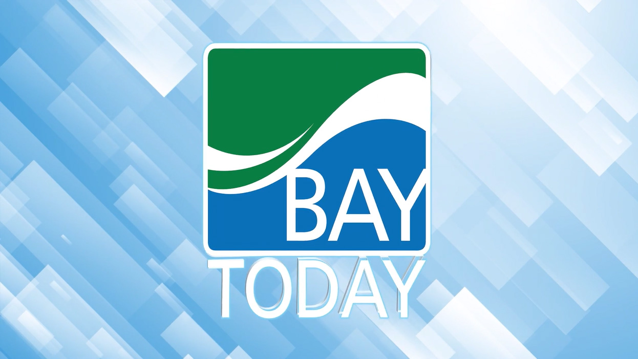 The Bay Today Bay College news logo against an abastract background of light blue diagonal rectangles.