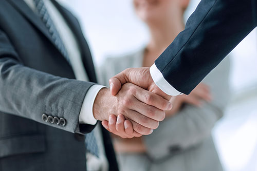 TWo people shaking hands
